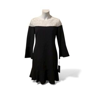Karl Lagerfeld Classy tulip sleeve with lace neckline accent. Brand new